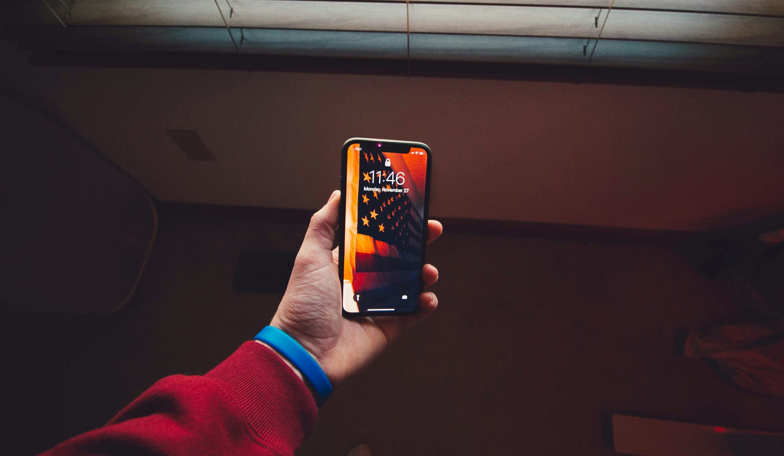 person holding iPhone X